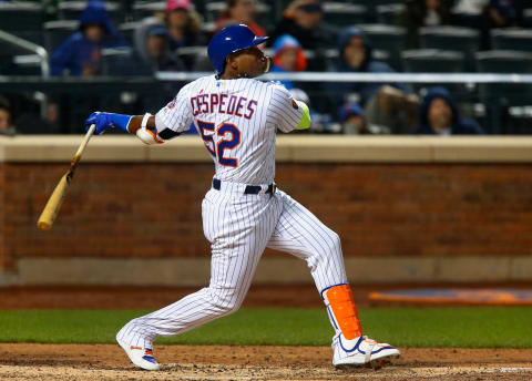 NEW YORK, NY – APRIL 14: Yoenis Cespedes #52 of the New York Mets follows through on a sixth inning RBI single against the Milwaukee Brewers at Citi Field on April 14, 2018 in the Flushing neighborhood of the Queens borough of New York City. (Photo by Jim McIsaac/Getty Images)