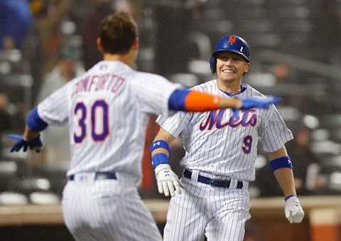 NEW YORK, NY – MAY 19: Michael Conforto #30 and Brandon Nimmo #9 of the New York Mets celebrate after Nimmo scored the game winning run on a sacrifice fly ball hit by Wilmer Flores in the ninth inning in an MLB baseball game against the Arizona Diamondbacks on May 19, 2018 in the fog and rain at CitiField in the Queens borough of New York City. Mets won 5-4. (Photo by Paul Bereswill/Getty Images) *** Local Caption *** Michael Conforto; Brandon Nimmo