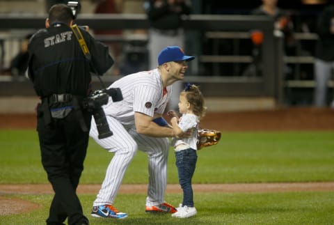 NEW YORK, NY – SEPTEMBER 29: David Wright #5 of the New York Mets picks up his two year daughter Olivia after she threw the ceremonial first pitch of a game against the Miami Marlins at Citi Field on September 29, 2018 in the Flushing neighborhood of the Queens borough of New York City. (Photo by Jim McIsaac/Getty Images)