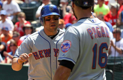 ARLINGTON, TX – JUNE 25: Carlos Beltran #15 of the New York Mets celebrates a run with Angel Pagan against the Texas Rangers at Rangers Ballpark in Arlington on June 25, 2011 in Arlington, Texas. (Photo by Ronald Martinez/Getty Images)