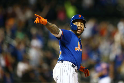 NEW YORK, NEW YORK – SEPTEMBER 29: Dominic Smith #22 of the New York Mets celebrates after hitting a walk-off 3-run home run in the bottom of the eleventh inning against the Atlanta Braves at Citi Field on September 29, 2019 in New York City. (Photo by Mike Stobe/Getty Images)