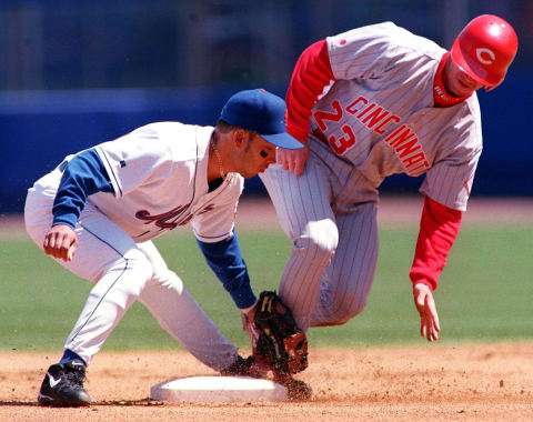 New York Mets shortstop Ray Ordonez (L) puts the tag down too late as the Cincinnati Reds’ Chris Stynes (R) steals second in the top of the first inning 25 April at Shea Stadium in New York City. The Reds beat the Mets 2-0. AFP PHOTO Matt CAMPBELL (Photo by MATT CAMPBELL / AFP) (Photo by MATT CAMPBELL/AFP via Getty Images)