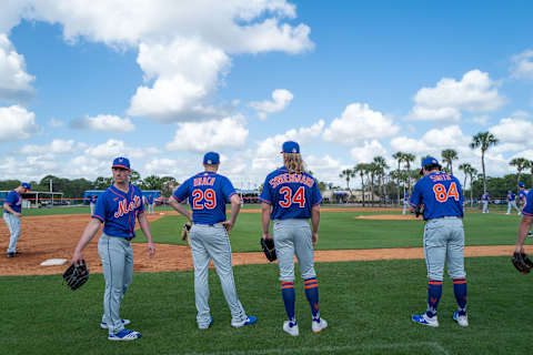 PORT ST. LUCIE, FLORIDA – FEBRUARY 20: Nick Rumbelow #71, Brad Brach #29, Noah Syndergaard #34 and Kevin Smith #84 of the New York Mets wait to pitch during the team workout at Clover Park on February 20, 2020 in Port St. Lucie, Florida. (Photo by Mark Brown/Getty Images)