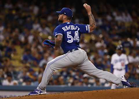 LOS ANGELES, CALIFORNIA – AUGUST 20: Pitcher Sean Reid-Foley #54 of the Toronto Blue Jays pitches in third inning of the MLB game against the Los Angeles Dodgers at Dodger Stadium on August 20, 2019 in Los Angeles, California. The Dodgers defeated the Blue Jays 16-3. (Photo by Victor Decolongon/Getty Images)