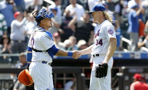 NEW YORK, NEW YORK – MAY 02: (NEW YORK DAILIES OUT) Noah Syndergaard #34 and Wilson Ramos #40 of the New York Mets celebrate after defeating the Cincinnati Reds at Citi Field on May 02, 2019 in New York City. The Mets defeated the Reds 1-0. (Photo by Jim McIsaac/Getty Images)