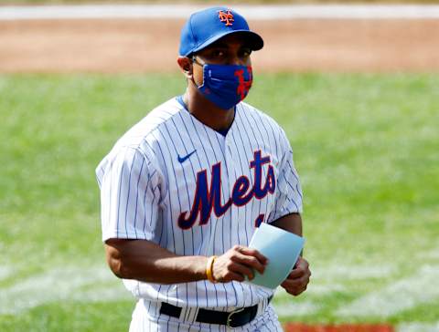 NEW YORK, NEW YORK – JULY 25: Manager Luis Rojas #19 of the New York Mets walks on the field before a game against the Atlanta Braves at Citi Field on July 25, 2020 in New York City. The 2020 season had been postponed since March due to the COVID-19 pandemic. The Braves defeated the Mets 5-3 in ten innings. (Photo by Jim McIsaac/Getty Images)