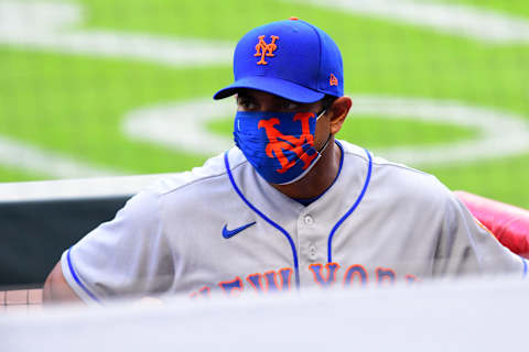 ATLANTA, GEORGIA – AUGUST 01: Manager Luis Rojas #18 of the New York Mets looks on during the game against the Atlanta Braves at Truist Park on August 01, 2020 in Atlanta, Georgia. (Photo by Scott Cunningham/Getty Images)