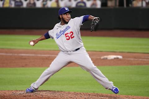 SEATTLE, WASHINGTON – AUGUST 19: Pedro Baez #52 of the Los Angeles Dodgers pitches in the sixth inning against the Seattle Mariners at T-Mobile Park on August 19, 2020 in Seattle, Washington. (Photo by Abbie Parr/Getty Images)