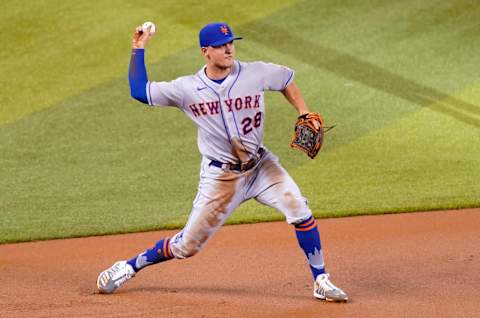 MIAMI, FLORIDA – AUGUST 19: J.D. Davis #28 of the New York Mets makes the throw to first base during the game against the Miami Marlins at Marlins Park on August 19, 2020 in Miami, Florida. (Photo by Mark Brown/Getty Images)