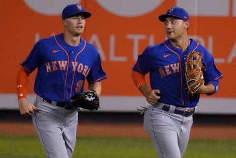 MIAMI, FLORIDA – AUGUST 18: Brandon Nimmo #9 of the New York Mets and Michael Conforto #30 head to the dugout during the game against the Miami Marlins at Marlins Park on August 18, 2020 in Miami, Florida. (Photo by Mark Brown/Getty Images)