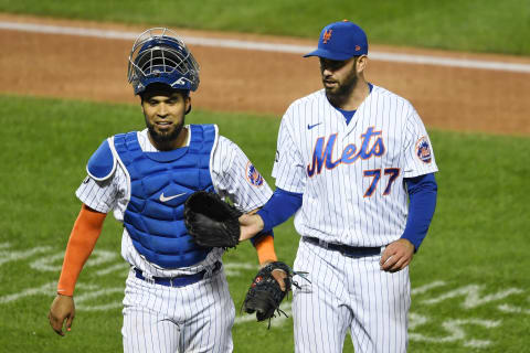 NEW YORK, NEW YORK – SEPTEMBER 19: David Peterson #77 of the New York Mets high-fives Robinson Chirinos #26 during the fifth inning against the Atlanta Braves at Citi Field on September 19, 2020 in the Queens borough of New York City. (Photo by Sarah Stier/Getty Images)