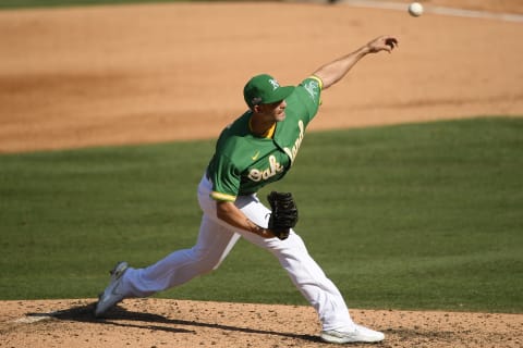 LOS ANGELES, CALIFORNIA – OCTOBER 06: Mike Minor #23 of the Oakland Athletics pitches against the Houston Astros during the sixth inning in Game Two of the American League Division Series at Dodger Stadium on October 06, 2020 in Los Angeles, California. (Photo by Kevork Djansezian/Getty Images)