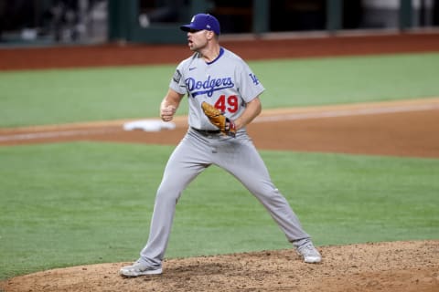 ARLINGTON, TEXAS – OCTOBER 25: Blake Treinen #49 of the Los Angeles Dodgers celebrates after striking out Willy Adames of the Tampa Bay Rays to secure the 4-2 victory in Game Five of the 2020 MLB World Series at Globe Life Field on October 25, 2020 in Arlington, Texas. (Photo by Tom Pennington/Getty Images)