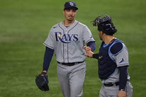 ARLINGTON, TEXAS – OCTOBER 27: Blake Snell #4 and Mike Zunino #10 of the Tampa Bay Rays walk back to the dugout after retiring the side against the Los Angeles Dodgers during the fifth inning in Game Six of the 2020 MLB World Series at Globe Life Field on October 27, 2020 in Arlington, Texas. (Photo by Ronald Martinez/Getty Images)