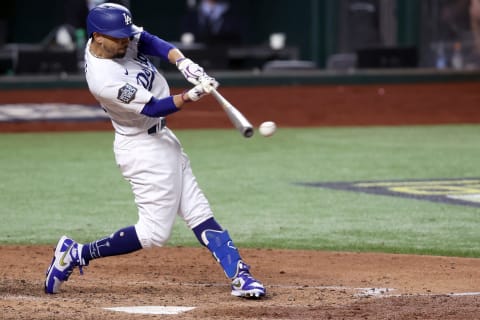 ARLINGTON, TEXAS – OCTOBER 27: Mookie Betts #50 of the Los Angeles Dodgers hits a double against the Tampa Bay Rays during the sixth inning in Game Six of the 2020 MLB World Series at Globe Life Field on October 27, 2020 in Arlington, Texas. (Photo by Tom Pennington/Getty Images)