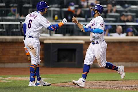 NEW YORK, NEW YORK – APRIL 14: Jeff McNeil #6 high-fives Francisco Lindor #12 of the New York Mets after he scored during the eighth inning against the Philadelphia Phillies at Citi Field on April 14, 2021 in the Queens borough of New York City. (Photo by Sarah Stier/Getty Images)