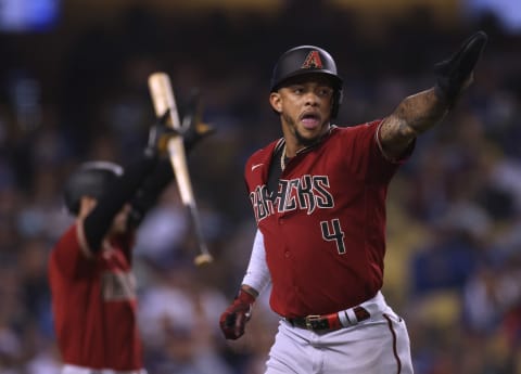 LOS ANGELES, CALIFORNIA – SEPTEMBER 15: Ketel Marte #4 of the Arizona Diamondbacks celebrates his run from a Henry Ramos #21 single during the fourth inning at Dodger Stadium on September 15, 2021 in Los Angeles, California. (Photo by Harry How/Getty Images)