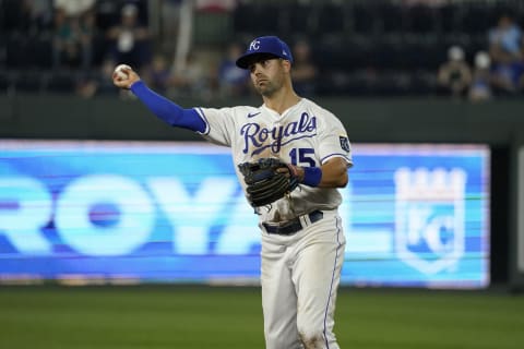 KANSAS CITY, MO – SEPTEMBER 18: Whit Merrifield #15 of the Kansas City Royals throws to first in the ninth inning against the Seattle Mariners at Kauffman Stadium on September 18, 2021 in Kansas City, Missouri. (Photo by Ed Zurga/Getty Images)