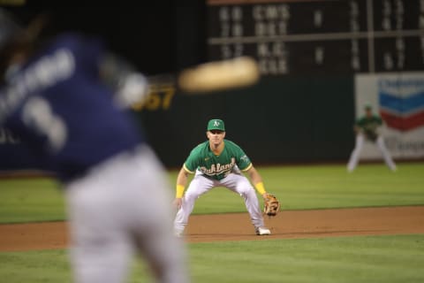 OAKLAND, CA – SEPTMEBER 21: Matt Chapman #26 of the Oakland Athletics fields during the game against the Seattle Mariners at RingCentral Coliseum on September 21, 2021 in Oakland, California. The Mariners defeated the Athletics 5-2. (Photo by Michael Zagaris/Oakland Athletics/Getty Images)