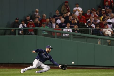 BOSTON, MASSACHUSETTS – OCTOBER 11: Kevin Kiermaier #39 of the Tampa Bay Rays makes a sliding catch for the out on J.D. Martinez #28 of the Boston Red Sox in the second inning during Game 4 of the American League Division Series at Fenway Park on October 11, 2021 in Boston, Massachusetts. (Photo by Winslow Townson/Getty Images)