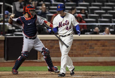 NEW YORK, NY – APRIL 09: Jason Bay #44 of the New York Mets strikes out in the fourth inning as Jesus Flores #26 of the Washington Nationals returns the ball at Citi Field on April 9, 2012 in the Flushing neighborhood of the Queens borough of New York City. (Photo by Jim McIsaac/Getty Images)