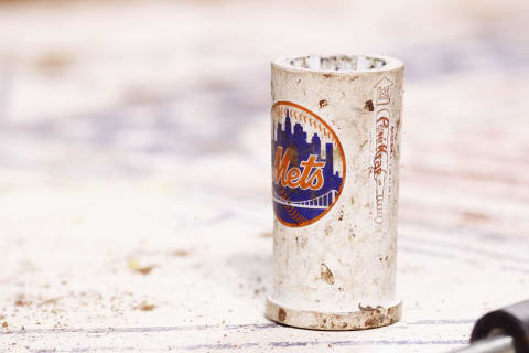 CINCINNATI, OH – AUGUST 14: Detail view of a bat weight in the on-deck circle during the game between the Cincinnati Reds and New York Mets at Great American Ball Park on August 14, 2012 in Cincinnati, Ohio. The Reds won 3-0. (Photo by Joe Robbins/Getty Images)