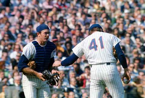 NEW YORK – CIRCA 1970: Catcher Jerry Grote #15 of the New York Mets comes out to talk with pitcher Tom Seaver #41 during an Major League Baseball game circa 1970 at Shea Stadium in the Queens borough of New York City. Grote played for the Mets from 1966-77. (Photo by Focus on Sport/Getty Images)