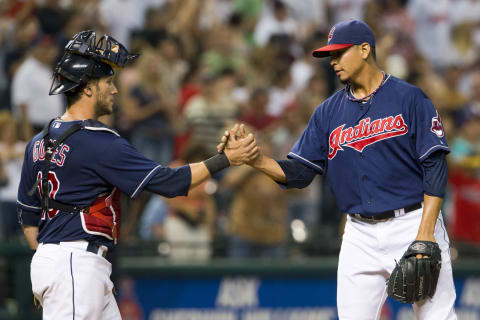 CLEVELAND, OH – SEPTEMBER 7: Catcher Yan Gomes #10 celebrates with closing pitcher Carlos Carrasco #59 of the Cleveland Indians after the last out against the New York Mets at Progressive Field on September 7, 2013 in Cleveland, Ohio. The Indians defeated the Mets 9-4. (Photo by Jason Miller/Getty Images)