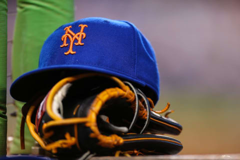 MIAMI, FL – AUGUST 04: A New York Mets hat and glove sit on the steps of the dugout during the game against the Miami Marlins at Marlins Park on August 4, 2015 in Miami, Florida. (Photo by Rob Foldy/Getty Images)