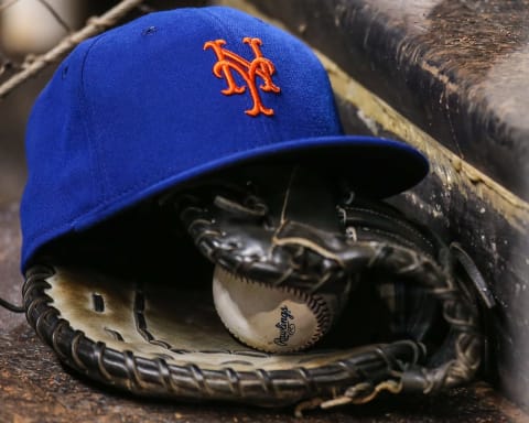 MIAMI, FL – AUGUST 04: A New York Mets hat and glove sit on the steps of the dugout during the game against the Miami Marlins at Marlins Park on August 4, 2015 in Miami, Florida. (Photo by Rob Foldy/Getty Images)