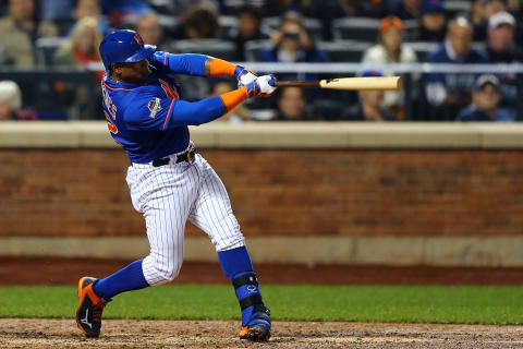 NEW YORK, NY – OCTOBER 12: Yoenis Cespedes #52 of the New York Mets hits a three run home run against Alex Wood #57 of the Los Angeles Dodgers in the fourth inning during game three of the National League Division Series at Citi Field on October 12, 2015 in New York City. (Photo by Elsa/Getty Images)