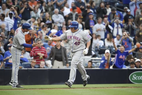 SAN DIEGO, CALIFORNIA – MAY 7: Bartolo Colon #40 of the New York Mets, right, is congratulated by Tim Teufel #11 after hitting a two-home run home run for the first of his career during the second inning of a baseball game against the San Diego Padres at PETCO Park on May 7, 2016 in San Diego, California. (Photo by Denis Poroy/Getty Images)