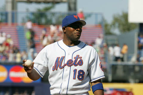 FLUSHING, NY – AUGUST 6: Infielder Marlon Anderson #18 of the New York Mets holds the ball during the game against the Chicago Cubs at Shea Stadium on August 6, 2005 in Flushing, New York. The Mets defeated the Cubs 2-0.(Photo by Jim McIsaac /Getty Images)