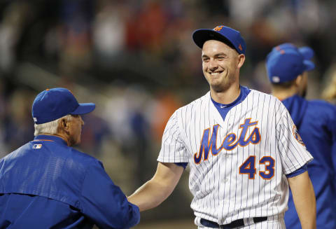 NEW YORK, NY – MAY 20: Relief pitcher Addison Reed #43 of the New York Mets is all smiles as he shakes hands with Manager Terry Collins after closing out the Mets 7-5 win in an interleague MLB baseball game against the Los Angeles Angels of Anaheim on May 20, 2017 at CitiField in the Flushing neighborhood of the Queens borough of New York City. (Photo by Paul Bereswill/Getty Images)