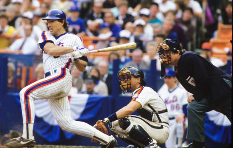 FLUSHING, NY – OCTOBER 1986: Gary Carter #8 of the New York Mets batting against the Houston Astros during the League Championship Series at Shea Stadium in October 1986. (Photo by Ronald C. Modra/Getty Images)