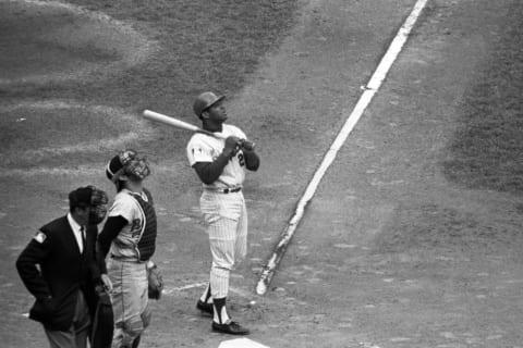 FLUSHING, NY – OCTOBER 16, 1969: Outfielder Tommie Agee #20 of the New York Mets watches a ball go into foul territory during Game 5 of the World Series on October 16, 1969 against the Baltimore Orioles at Shea Stadium in New York, New York. The Orioles’ catcher is Andy Etchebarren #8 and the home plate umpire is Lou DiMuro. (Photo by: Kidwiler Collection/Diamond Images/Getty Images)