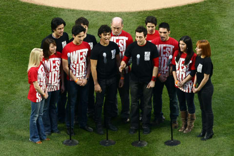 NEW YORK – APRIL 13: The cast of West Side Story perform the National Anthem before the San Diego Padres against the New York Mets during opening day at Citi Field on April 13, 2009 in the Flushing neighborhood of the Queens borough of New York City. This is the first regular season MLB game being played at the new venue which replaced Shea stadium as the Mets home field. (Photo by Chris McGrath/Getty Images)