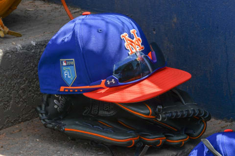 WEST PALM BEACH, FL – MARCH 08: A detailed view of the hat, sunglasses and glove of a New York Mets player in the dugout steps during the spring training game at FITTEAM Ballpark of the Palm Beaches on March 8, 2018 in West Palm Beach, Florida. (Photo by B51/Mark Brown/Getty Images) *** Local Caption ***