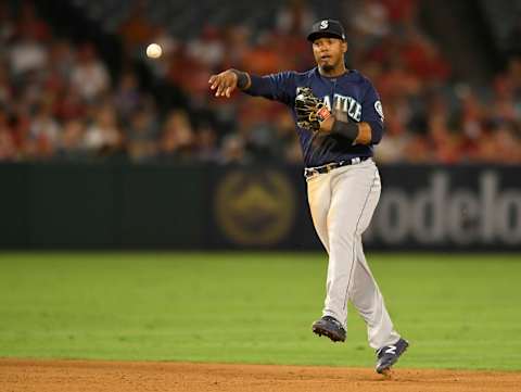 ANAHEIM, CA – SEPTEMBER 14: Jean Segura #2 of the Seattle Mariners makes a throw to first base to put out David Fletcher #6 of the Los Angeles Angels of Anaheim in the sixth inning at Angel Stadium on September 14, 2018 in Anaheim, California. (Photo by John McCoy/Getty Images)