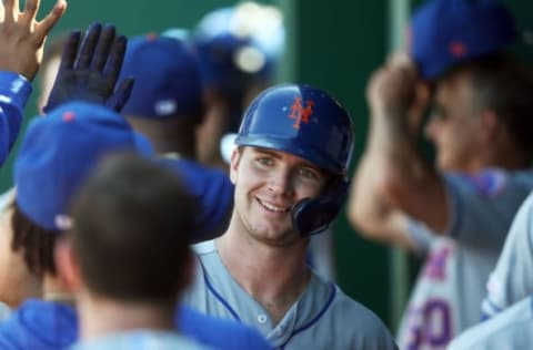 KANSAS CITY, MISSOURI – AUGUST 18: Pete Alonso #20 of the New York Mets is congratulated by teammates in the dugout after hitting a home run during the 8th inning of the game against the Kansas City Royals at Kauffman Stadium on August 18, 2019 in Kansas City, Missouri. (Photo by Jamie Squire/Getty Images)