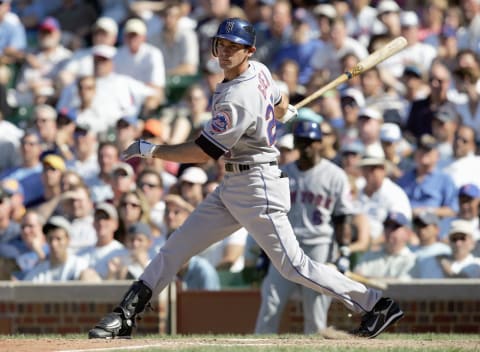 CHICAGO – AUGUST 3: Shawn Green #20 of the New York Mets makes a hit during the game against the Chicago Cubs on August 3, 2007 at Wrigley Field in Chicago, Illinois. (Photo by Jonathan Daniel/Getty Images)