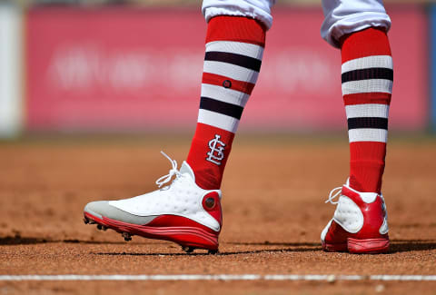 Mar 8, 2019; Jupiter, FL, USA; A detailed view of the socks and cleats of St. Louis Cardinals right fielder Dexter Fowler (25) between innings of the spring training game against the Washington Nationals at Roger Dean Chevrolet Stadium. Mandatory Credit: Jasen Vinlove-USA TODAY Sports