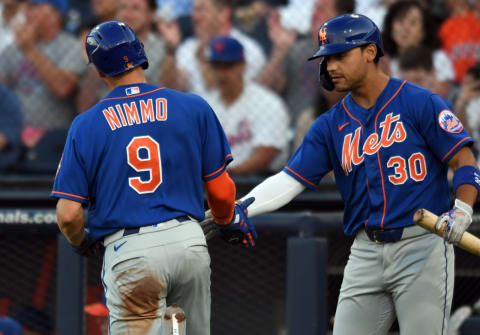 Mar 6, 2020; West Palm Beach, Florida, USA; New York Mets outfielder Brandon Nimmo (9) in congratulated by designated hitter Michael Conforto (30) after scoring a run against the Houston Astros in first inning at FITTEAM Ballpark of the Palm Beaches. Mandatory Credit: Jim Rassol-USA TODAY Sports