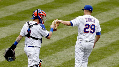 Aug 13, 2020; New York City, New York, USA; New York Mets relief pitcher Brad Brach (29) and catcher Tom‡s Nido (3) react after defeating the Washington Nationals at Citi Field. Mandatory Credit: Andy Marlin-USA TODAY Sports