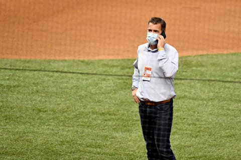 Aug 20, 2020; Miami, Florida, USA; New York Mets general manager Brodie Van Wagenen looks at his phone. The game between the Miami Marlins and the New York Mets at Marlins Park has been postponed after a member of the New York Mets tested positive for Covid-19. Mandatory Credit: Jasen Vinlove-USA TODAY Sports