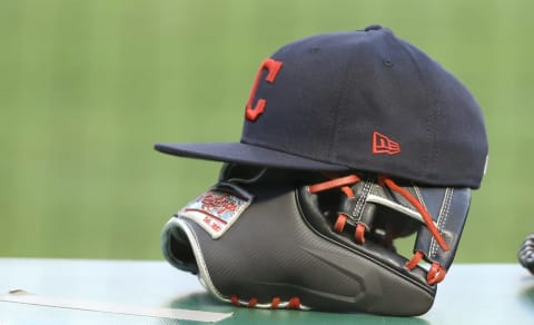 Aug 19, 2020; Pittsburgh, Pennsylvania, USA; Cleveland Indians hats and glove on the dugout rail against the Pittsburgh Pirates during the third inning at PNC Park. The Indians won 6-1. Mandatory Credit: Charles LeClaire-USA TODAY Sports