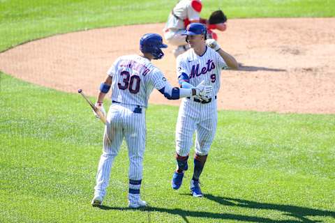 Sep 6, 2020; New York City, New York, USA; New York Mets center fielder Brandon Nimmo (9) is greeted by right fielder Michael Conforto (30) after hitting a solo home run in the sixth inning against the Philadelphia Phillies at Citi Field. Mandatory Credit: Wendell Cruz-USA TODAY Sports