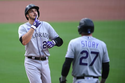 Sep 8, 2020; San Diego, California, USA; Colorado Rockies third baseman Nolan Arenado (L) gestures after hitting a three-run home run during the first inning against the San Diego Padres at Petco Park. Mandatory Credit: Orlando Ramirez-USA TODAY Sports