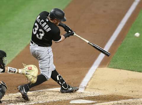 Sep 9, 2020; Pittsburgh, Pennsylvania, USA; Chicago White Sox catcher James McCann (33) drives in a run with a sacrifice fly against the Pittsburgh Pirates during the fourth inning at PNC Park. Mandatory Credit: Charles LeClaire-USA TODAY Sports