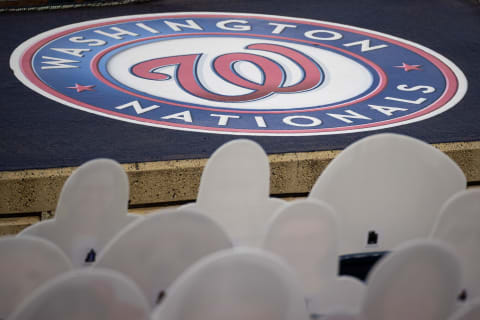 Sep 11, 2020; Washington, District of Columbia, USA; A Washington Nationals logo is seen in front of cutouts of fans in the seats during the third inning of the game between the Washington Nationals and the Atlanta Braves at Nationals Park. Mandatory Credit: Scott Taetsch-USA TODAY Sports